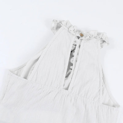 Light gray dress with ruffled details on a white background
