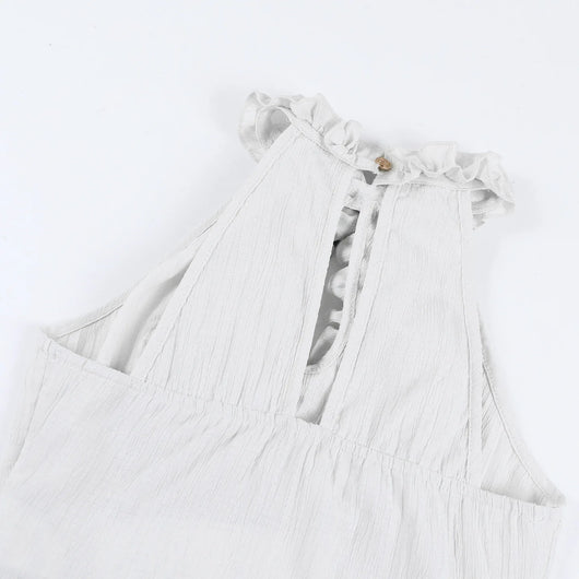 Light gray dress with ruffled details on a white background